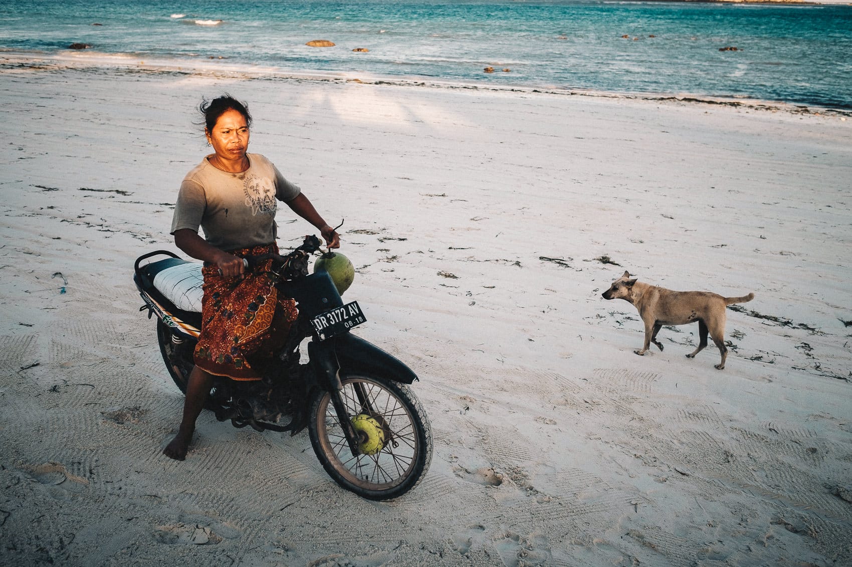 04 Praya Barat Biker Woman and a Stray Dog